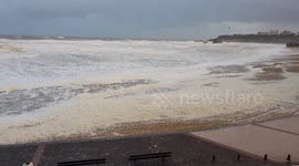 Foam fills beach during storm in southern France