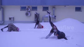 Snow-ga! Russians do yoga in sub-zero conditions