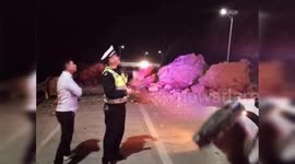 Coach crashes into giant fallen rocks after landslide in China