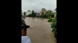 A Man Desperately Try Float As Flooded River Dragged Him