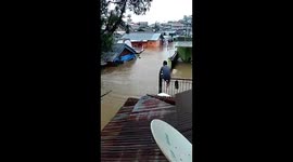 People Go to the Higher Place as Flood Level Raise in Manado, Indonesia