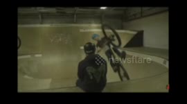 Jumping over someone's head on mountain bike