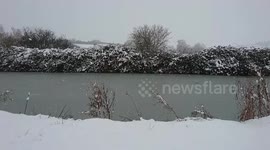 Snowing on the Kennet & Avon canal in Wiltshire, UK