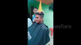 Hot new style! Indian barber sets hair on fire to achieve perfect cut