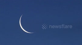 PLANET SATURN APPEARS BEHIND MOON AFTER OCCULTATION