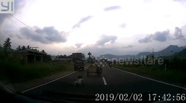 Child riding auto-rickshaw slips under the seat and almost gets run over