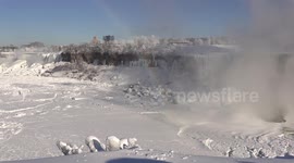Niagara falls turns to ice in severe polar vortex winter weather making for a beautiful scene for tourists and photographers