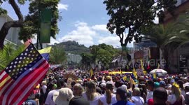 A venezuelan citizen hold an USA flag in support to interin president Juan Guaido
