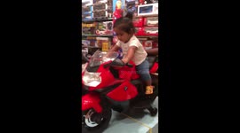 1 year kid riding BMW motorbike..