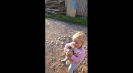 Harriett Plays on her slide with lavender chicken
