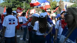 Supporters of political parties wave their flags