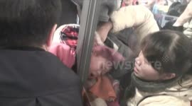 Small girl rescued form revolving door in China