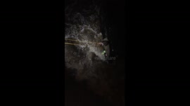 Driver winched to safety as 'weather bomb' hits the UK
