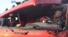 Man wears helmet to drive severely damaged lorry in China