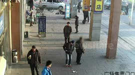 Commuters ignore cash on the ground at railway station in China