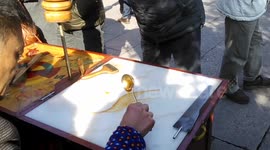 Street vendor makes phoenix-shaped sweet with maltose syrup