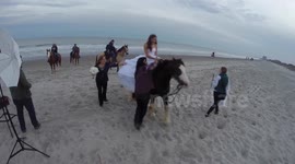 Bride thrown from horse during photo shoot