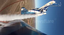 Cockpit view of three stunt airplanes chained together