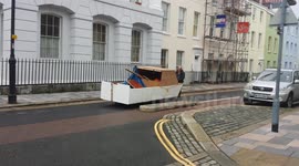 homless Man heading for the sea with makeshift boat plymouth