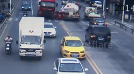 Car smashed between two lorries in China