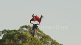 Santa Claus backflips a dirt bike in Australia