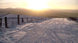 Mountain Top Sunset Over Snow