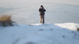 Winter Scene - Man Walking On Snow
