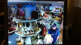 Picture frame falls from shelf at haunted shop