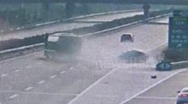 Coach hit backing BMW on highway in China