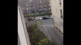 Man takes cover from gunfire in Paris attack