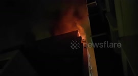Moment firefighters attempt to enter burning Paris apartment block