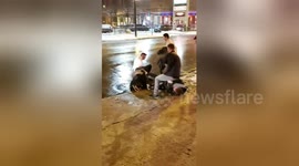 Newsflare Edit - Two Men Fighting In The Snow Outside A Bar In Chicago
