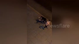 Wahey! Student tumbles after friend smacks takeaway out of his hand