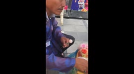 The man shaped the pig from rice powder in the Lunar New Year