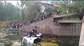 Passengers lifted to safety by crane after bus falls into open drain