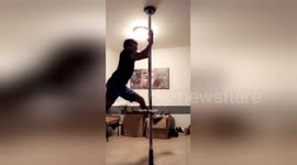 Man tries out pole dancing for the first time but ends up on the floor
