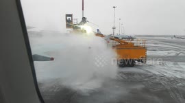 British Airways Boeing is being covered with antifreeze before the flight from snowy Russia