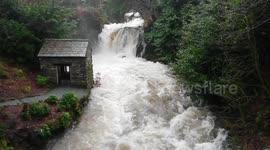 Heavy rain from Storm Erik turns Lake District rivers into raging torrents at Rydal Hall, Ambleside, UK