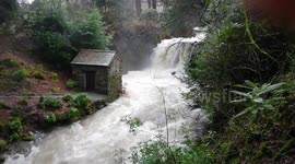 Heavy rain from Storm Erik turns Lake District rivers into raging torrents at Rydal Hall, Ambleside, UK