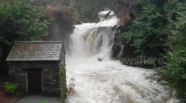 Heavy rain from Storm Erik turns Lake District rivers into raging torrents at Rydal Hall, Ambleside, UK