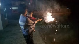 Family Playing Fireworks during Chinese New Year