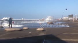 High tide surges onto boardwalk in Blackpool