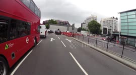 Motorcyclist misses turning, almost takes out cyclist