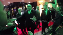 Jason Isaacs Is Chased By Autograph Hunters