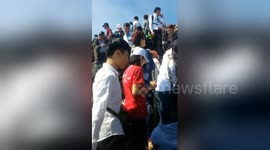 Human traffic jam on holy Vietnam mountain top during Lunar New Year