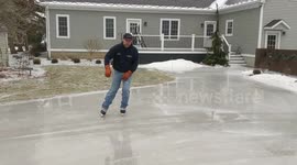 Michigan man skates gracefully on frozen driveway during recent polar vortex