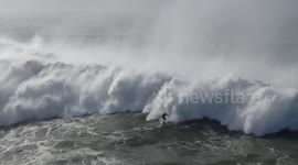 WITH CAPTIONS: US surfer escapes terrifying wipe out in series of giant waves off Nazaré