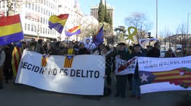 Catalan separatists go on trial amid protests in Madrid