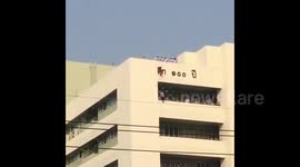 Four-year-old girl saved from lethal fall when her dress snags on building sign