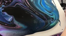 Incredible pour painting artwork looks like a galaxy